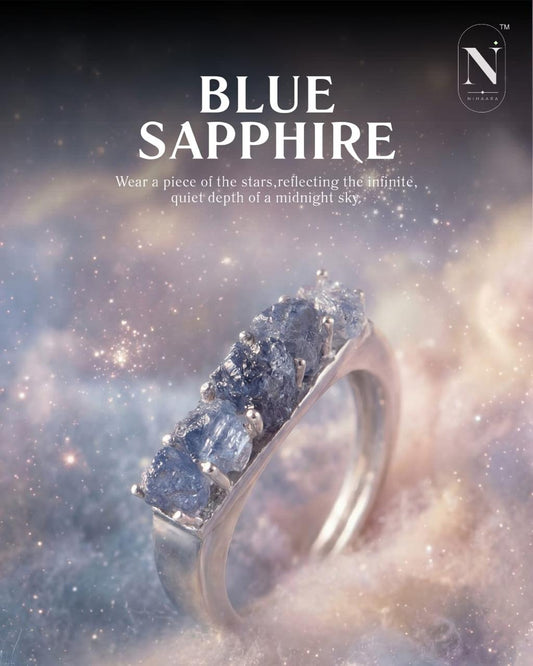Blue sapphire ring with a starry night sky background and Nivivendi logo.